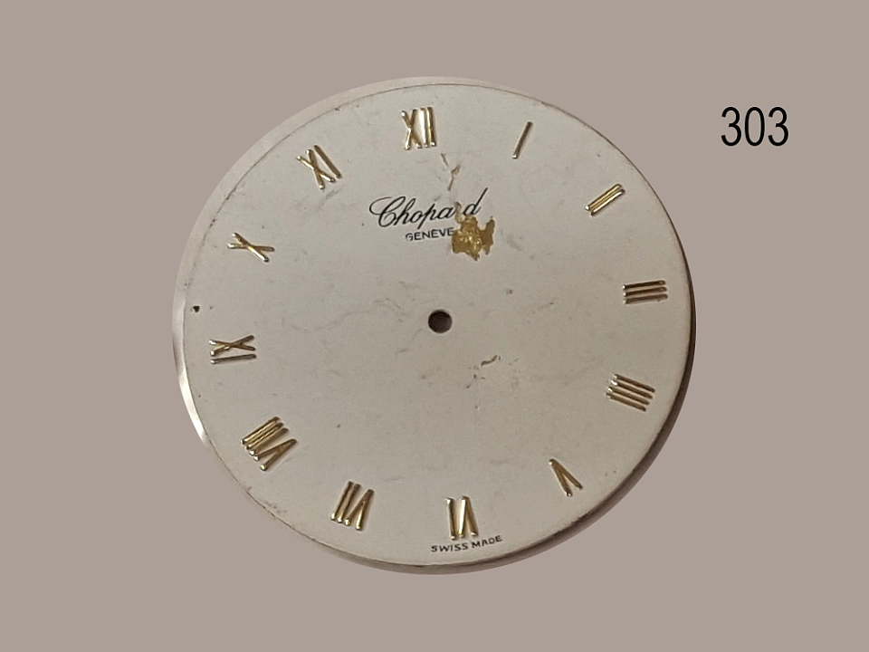 Asservat 303: Zifferblatt einer Uhr / Chopard / Geneve / Swiss Made